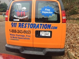 Water Damage Restoration Rear Of Van At Residential Job